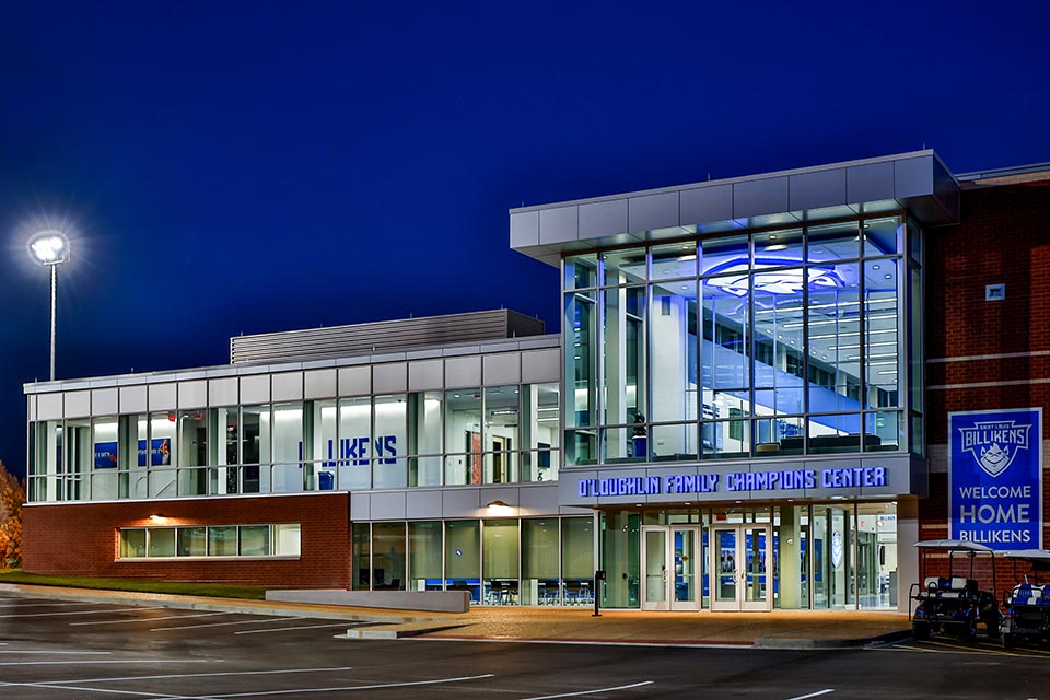 A photo of the O'Loughlin Family Champions Center at night. 